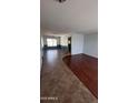 Spacious living room featuring two-toned walls, new flooring, and ample natural light at 8618 N 45Th Dr, Glendale, AZ 85302