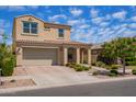 Charming two-story home with a tile roof, manicured landscaping, and an attached two-car garage at 9764 E Radioactive Dr, Mesa, AZ 85212