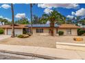 Charming one-story home featuring desert landscaping, solar panels, and a two-car garage at 134 E Le Marche Ave, Phoenix, AZ 85022
