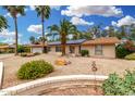 Inviting single-story home with well-maintained desert landscaping and a brick facade at 134 E Le Marche Ave, Phoenix, AZ 85022
