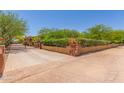 Gated entrance showcasing the property's well-maintained landscaping and privacy features at 14619 E Desert Vista Trl, Scottsdale, AZ 85262