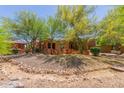 Charming exterior showing beautiful desert landscaping and a well maintained yard at 14619 E Desert Vista Trl, Scottsdale, AZ 85262