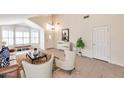 Bright living room boasts vaulted ceilings, large windows, and stylish furnishings for comfortable living at 2312 E Williams Dr, Phoenix, AZ 85024