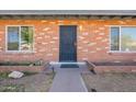 Close-up of the front entrance showcasing the brickwork and secure front door at 3107 W Tuckey Ln, Phoenix, AZ 85017