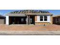 New construction home featuring an attached two-car garage and a partially installed roof at 32677 N Newby Dr, San Tan Valley, AZ 85143