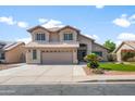 Charming two-story home with neutral color scheme, well-maintained landscaping, and spacious driveway leading to garage at 4226 E Stanford Ave, Gilbert, AZ 85234