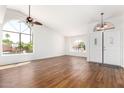 Bright living room with gorgeous floors and large windows offering lots of natural light at 5216 W Oraibi Dr, Glendale, AZ 85308
