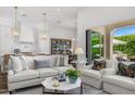 Open-concept living room boasts lots of natural light and views of the outdoor space at 5542 E Alan Ln, Paradise Valley, AZ 85253