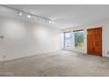 Well-lit living room with ample space and natural light from the windows at 7319 E Northland Dr # 5, Scottsdale, AZ 85251