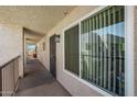 Exterior walkway showing secured entrances to individual units at 7474 E Earll Dr # 311, Scottsdale, AZ 85251