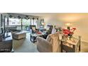 Comfortable living room with cozy furniture and a balcony view, perfect for relaxing at 7625 E Camelback Rd # A249, Scottsdale, AZ 85251
