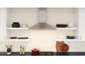 Well-lit kitchen showcasing modern open shelving, stainless steel range hood and white subway tile backsplash at 8006 W Griswold Rd, Peoria, AZ 85345
