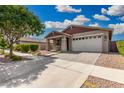 Pleasant single-story home featuring a well-maintained front yard and attached two-car garage at 10352 E Sebring Ave, Mesa, AZ 85212