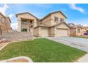 Charming two-story home featuring a 2-car garage, low maintenance landscaping, and neutral color palette at 13304 W Stella Ln, Litchfield Park, AZ 85340