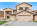 Charming two-story home featuring a 2-car garage, low maintenance landscaping, and neutral color palette at 13304 W Stella Ln, Litchfield Park, AZ 85340