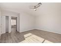 Spacious bedroom with wood-look flooring and a walk-in closet at 13521 E Butler St, Chandler, AZ 85225