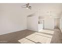 Bright living room with ceiling fan and wood-look flooring at 13521 E Butler St, Chandler, AZ 85225