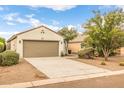 Front exterior view of a single-story home with desert landscaping at 1375 W Belmont Red Trl, San Tan Valley, AZ 85143