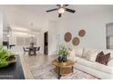 Inviting living room with open floorplan to the dining area, featuring a modern console and comfortable seating at 2035 S Elm St # 211, Tempe, AZ 85282