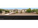 A beautifully landscaped front yard with pavers leading to the contemporary home at 2735 E King Bird Dr, Gilbert, AZ 85297