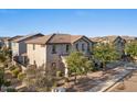 View of the side of the home showing a tiled roof, and view of the well manicured lawn at 2868 E Binner Dr, Chandler, AZ 85225