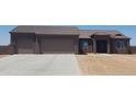 Spacious, single-story home with a three-car garage and desert landscaping at 300 W Quartz Rock Rd, Phoenix, AZ 85085