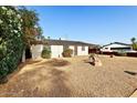 Cozy single-story home with desert landscaping and mature trees at 3532 N Carhill Ave, Scottsdale, AZ 85251