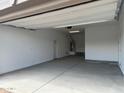 Clean, spacious garage with ample lighting and storage, ideal for parking and home projects at 3738 E Rochelle Cir, Mesa, AZ 85213