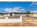 Charming single-story home with a two-car garage and drought-tolerant landscaping at 3828 W Townley Ave, Phoenix, AZ 85051