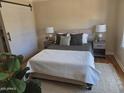 Cozy bedroom with neutral tones, stylish sliding barn door, and modern décor at 514 W Monte Vista Rd, Phoenix, AZ 85003