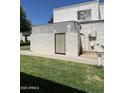 The side of the townhome, featuring a stucco privacy wall with a gate at 5212 N 42Nd Ln, Phoenix, AZ 85019