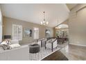 Neutral living room featuring vaulted ceilings, plantation shutters, and elegant furnishings, creating a cozy and stylish atmosphere at 5402 E Helena Dr, Scottsdale, AZ 85254
