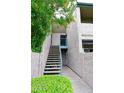 Apartment entrance featuring staircase and walkway with flowering tree and well kept foliage at 623 W Guadalupe Rd # 279, Mesa, AZ 85210