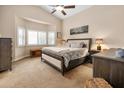 Bright main bedroom with a bay window, plush carpeting, and neutral decor at 641 W Mesquite Tree Ln, San Tan Valley, AZ 85143