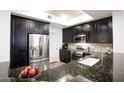 Well-equipped kitchen featuring stainless steel appliances and granite countertops at 7601 E Indian Bend Rd # 1050, Scottsdale, AZ 85250