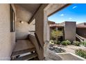 Attractive condo entrance with view of well-maintained landscaping and blue sky at 9450 N 94Th Pl # 214, Scottsdale, AZ 85258