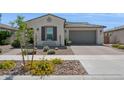 Inviting home showcasing a charming desert landscape and an attached two-car garage at 10631 E Tallahassee Ave, Mesa, AZ 85212