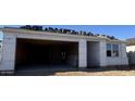 Exterior of a new home showing open garage for two cars. Personalize this blank slate at 15788 W Beryl Ave, Waddell, AZ 85355