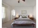 Bright main bedroom featuring a modern bed frame, ensuite bath, and lots of natural light at 20834 W Prospector Way, Buckeye, AZ 85396