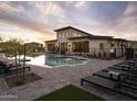 Inviting community pool offers comfortable lounge chairs for relaxation and a nearby modern community house at 2121 W Sonoran Desert Dr # 43, Phoenix, AZ 85085