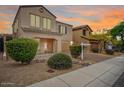 Charming two-story home with beautiful landscaping and a warm, inviting facade at 2323 W Hunter Ct, Phoenix, AZ 85085