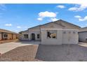 Attractive single-story home with a well-manicured gravel yard, neutral colors, and a welcoming entrance at 2512 N Pony Ln, Casa Grande, AZ 85122