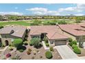 Aerial view of home showcasing nearby golf course and desert landscaping at 27320 N 127Th Dr, Peoria, AZ 85383