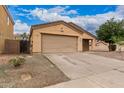 Inviting single-story home features a two-car garage and low-maintenance landscaping, perfect for easy living at 3728 W Fremont Rd, Phoenix, AZ 85041