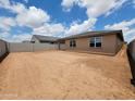 Expansive backyard space, perfect for creating your outdoor oasis with ample room for recreation and gardening at 37399 W San Sisto Ave, Maricopa, AZ 85138