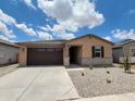 Inviting single-level house featuring a stone-accented facade, covered entry, and a finished two-car garage at 37399 W San Sisto Ave, Maricopa, AZ 85138