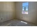 Bright bedroom featuring a large window, ample natural light, and neutral walls at 4521 S 95Th Dr, Tolleson, AZ 85353