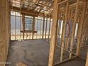 Framing of a room during construction, showcasing stud walls and window framing at 4521 S 95Th Dr, Tolleson, AZ 85353