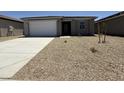 Charming single-story home with a well-maintained front yard and attached garage at 4521 S 95Th Dr, Tolleson, AZ 85353