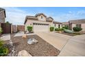 Well-maintained single-story home with desert landscaping and charming curb appeal at 4960 E Villa Theresa Dr, Scottsdale, AZ 85254